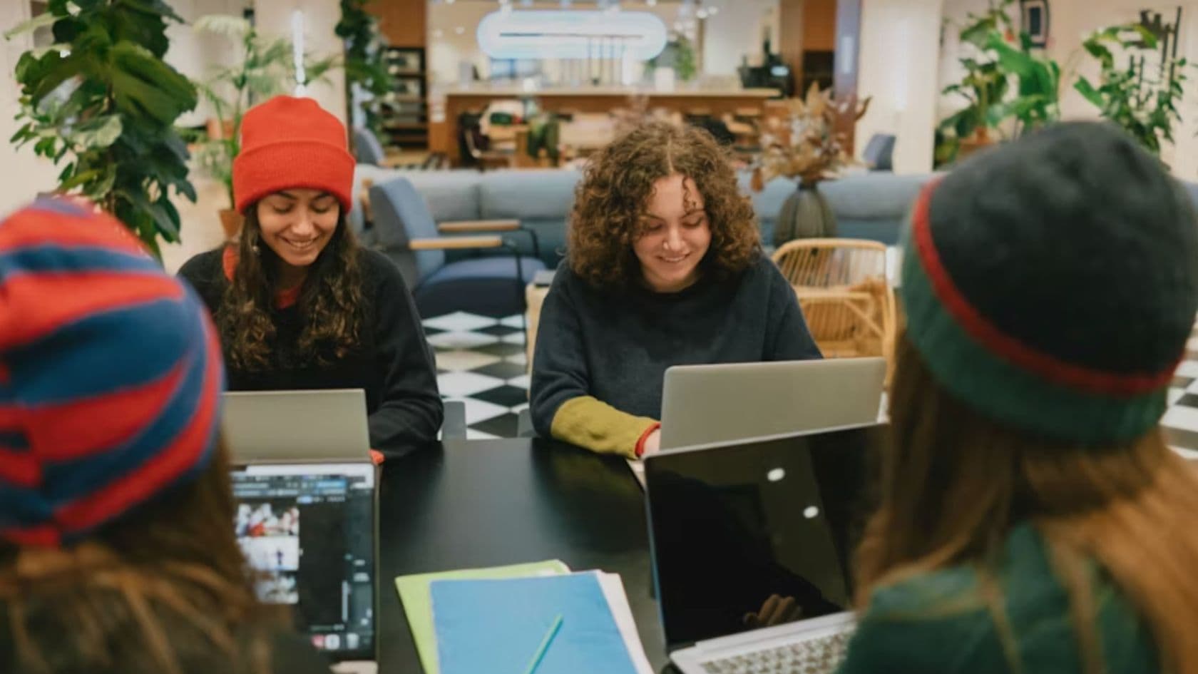 A Desert Rose Gives team member responding to community messages from a warm workspace.