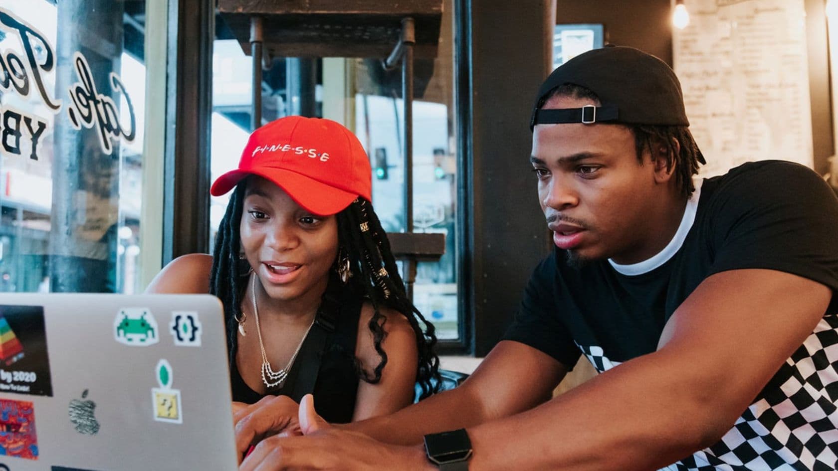A small group watching and discussing media together in a community setting.