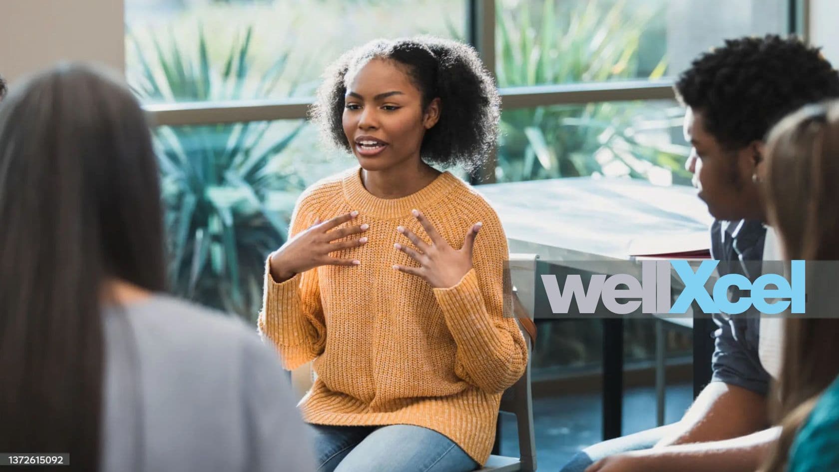 Young people seated in a community session during a WellXcel program in Nevada.